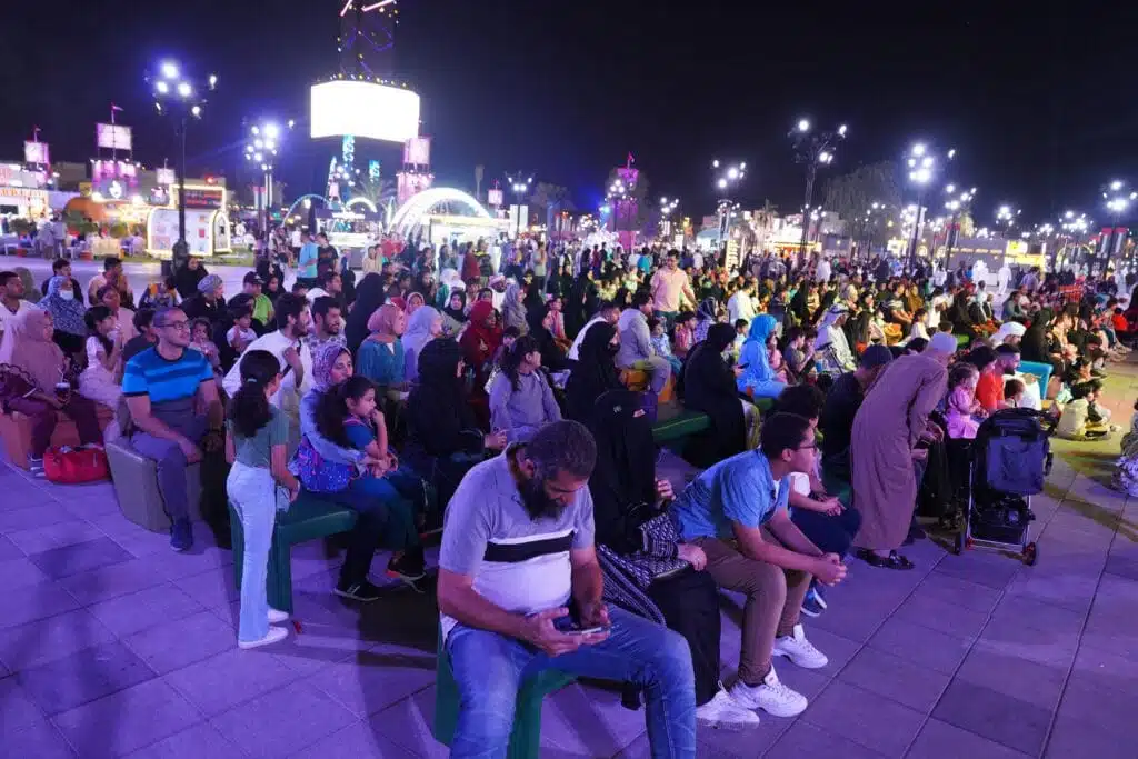 Dot Media live event audience watching theater performance.
