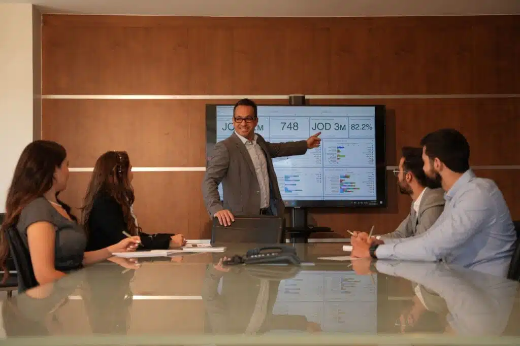 Dot Media business meeting - Manager explaining to team.
